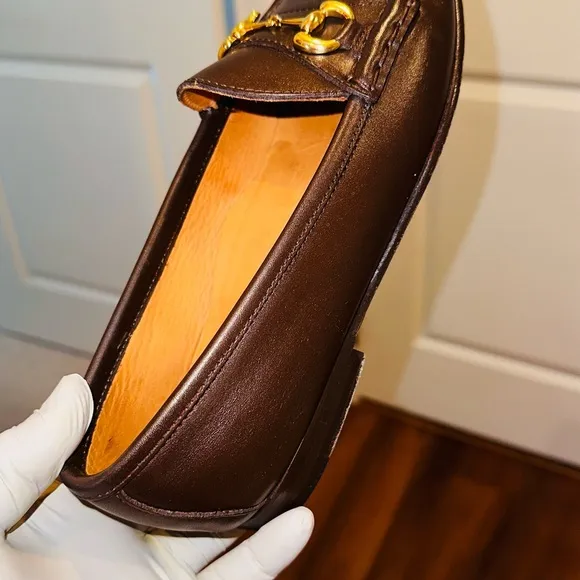 Jay Butler’s Brown Horse Bit Leather Loafers with Gold Detailing.