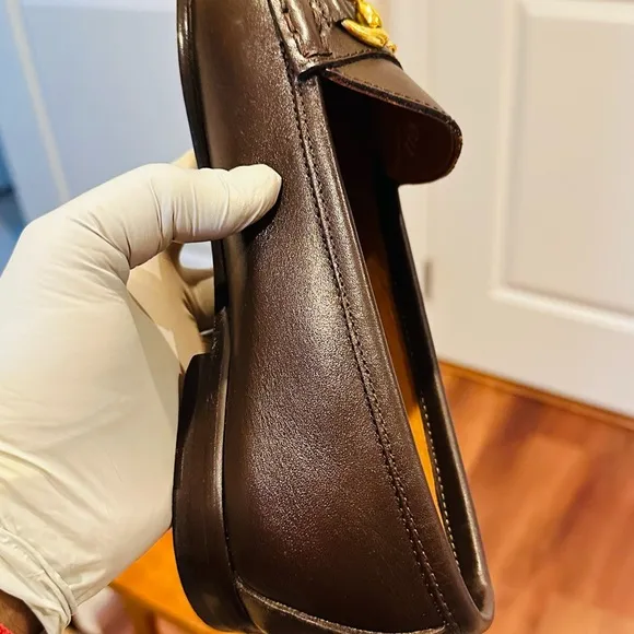 Jay Butler’s Brown Horse Bit Leather Loafers with Gold Detailing.