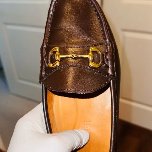 Jay Butler’s Brown Horse Bit Leather Loafers with Gold Detailing.