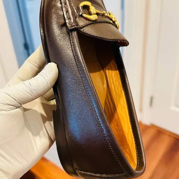 Jay Butler’s Brown Horse Bit Leather Loafers with Gold Detailing.