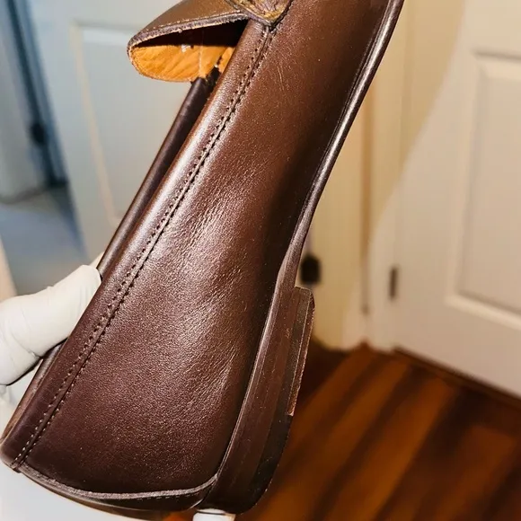 Jay Butler’s Brown Horse Bit Leather Loafers with Gold Detailing.