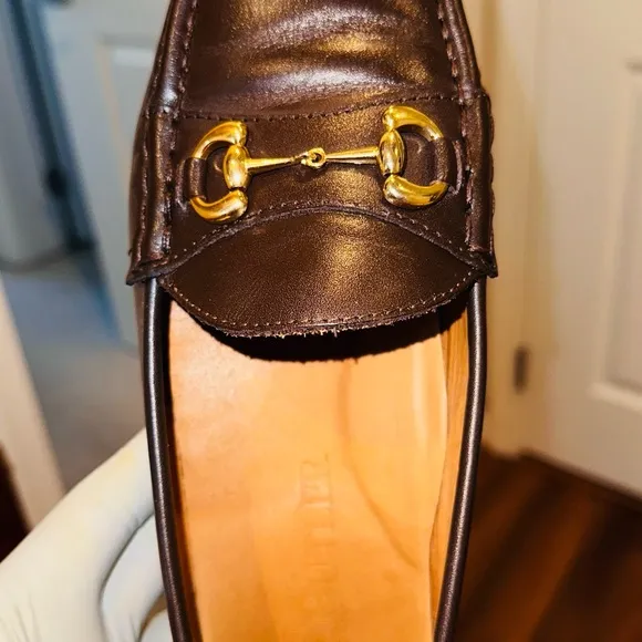 Jay Butler’s Brown Horse Bit Leather Loafers with Gold Detailing.