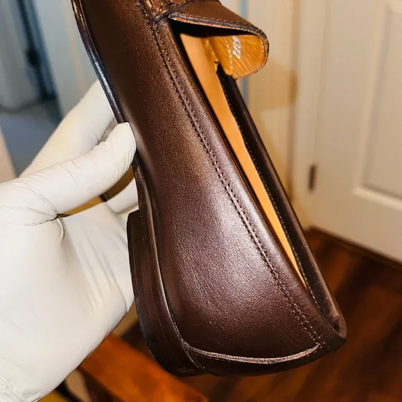 Jay Butler’s Brown Horse Bit Leather Loafers with Gold Detailing.