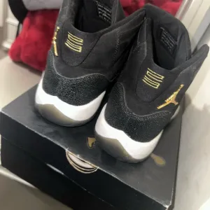 Jordan Black and Gold Sneakers with Iconic High-Top Design