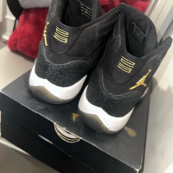 Jordan Black and Gold Sneakers with Iconic High-Top Design