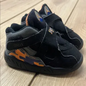 Jordan Black and Orange Retro Sneakers